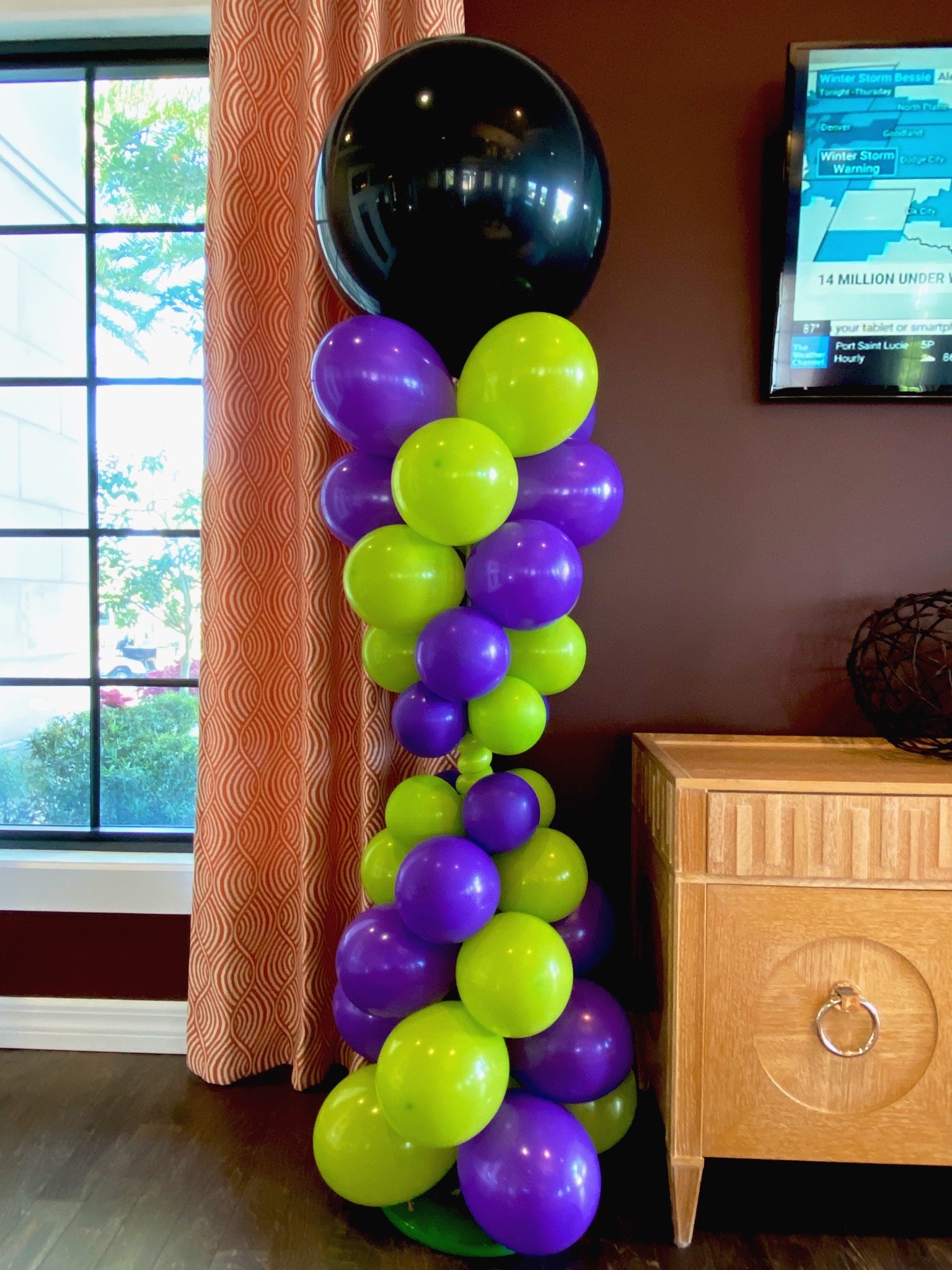 Colorful balloon column installation