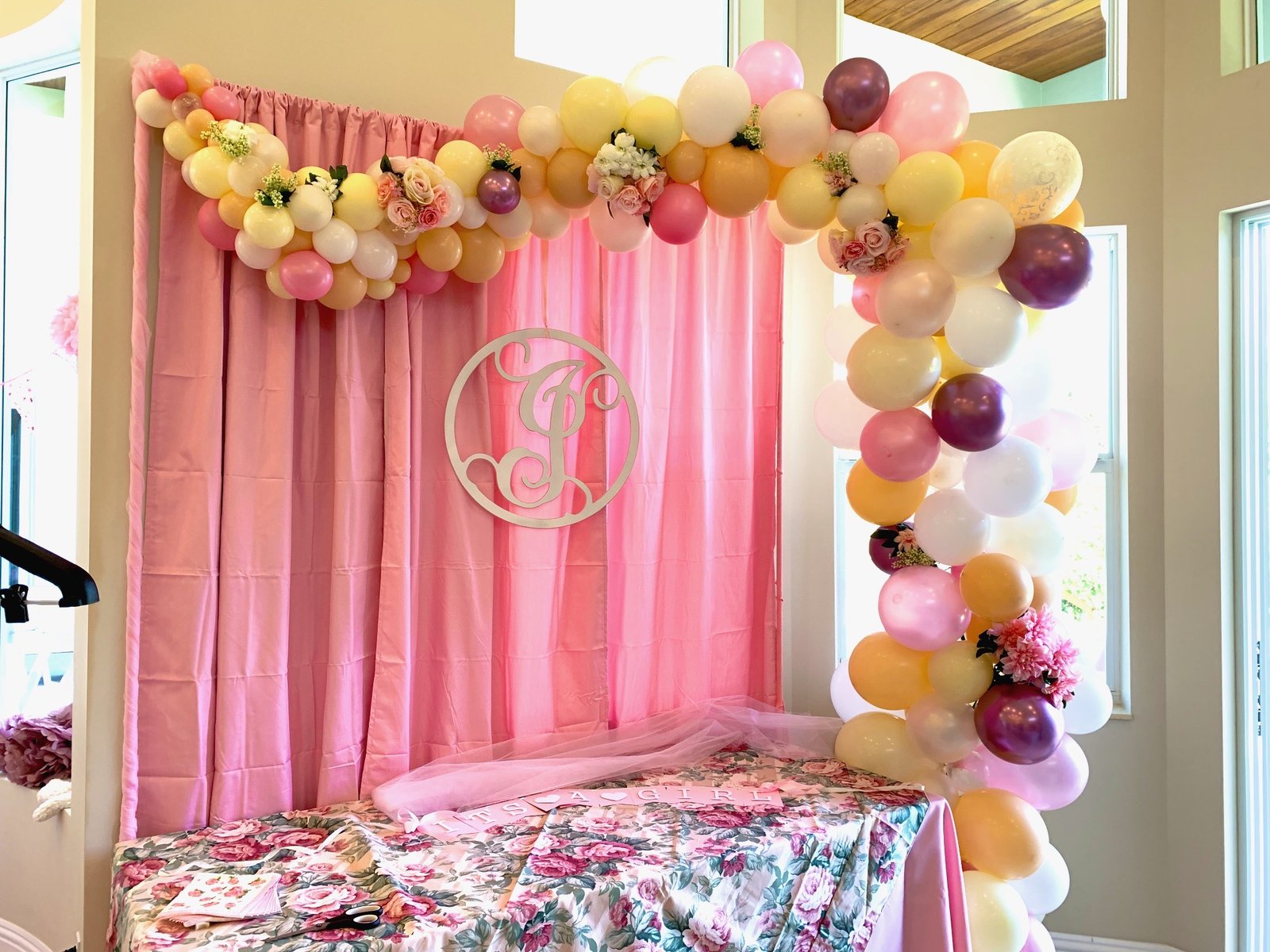 Elegant white and gold wedding balloon garland installation