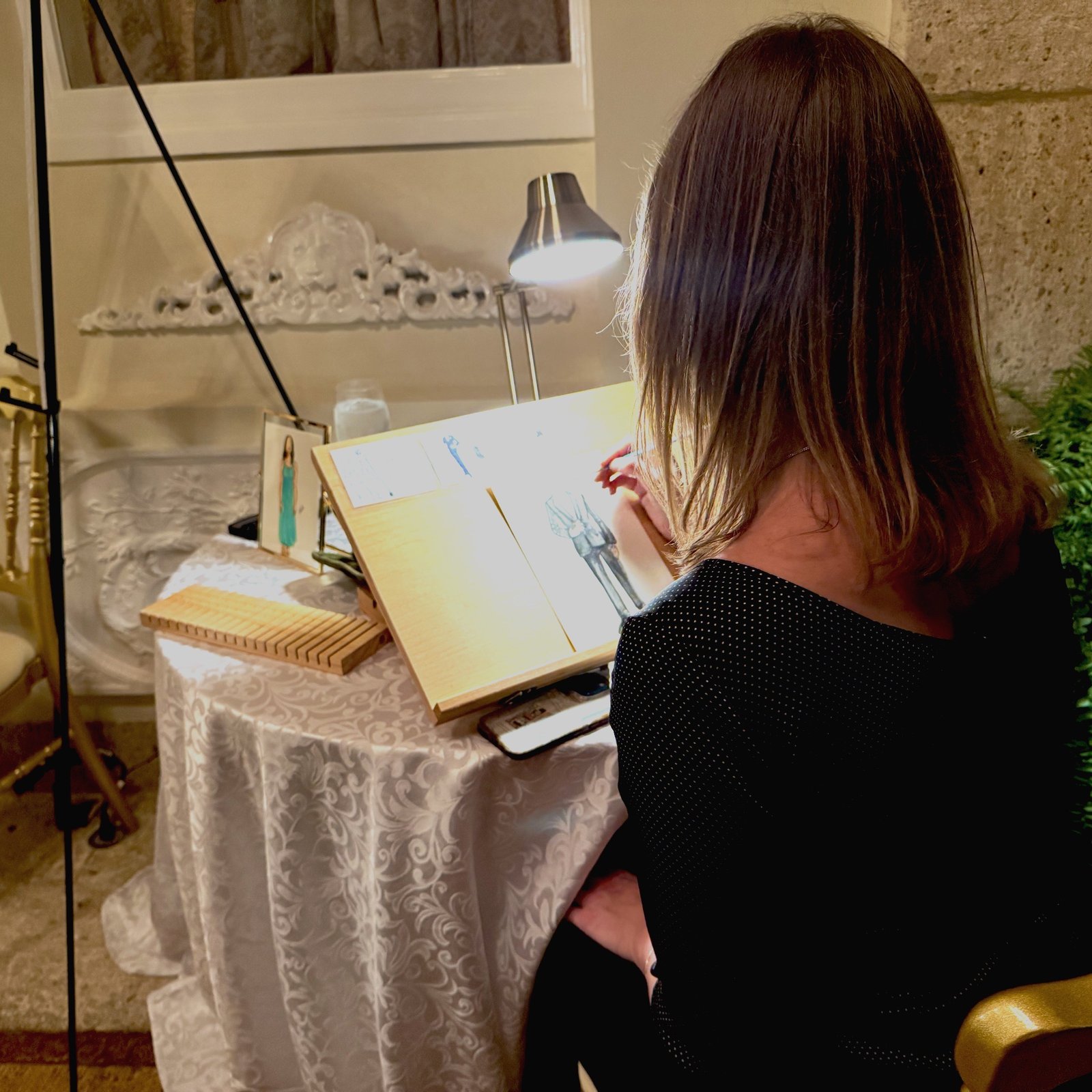 Fairy hair artist applying sparkling tinsel strands at an event